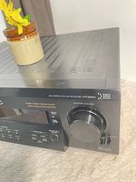 Front right side showing master volume knob and model marking
