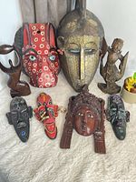 Grouped view of all masks and sculptures