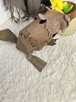 Side view of full beaver sculpture showing overall form and texture