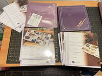 Two sealed albums and multiple sealed page/protector packs