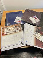 All items—two albums and four page packs—grouped on table