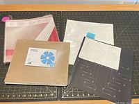 All items laid out: portrait sleeve packs, pocket page pack, loose pocket pages, family tree pages