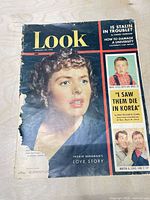 Front cover showing title, date, Ingrid Bergman photo, noticeable torn section at lower left