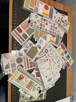 Pile of Creative Memories sticker sheets on table