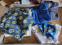 Overall view of shirts, placemats/napkins and packaged socks