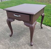 Three-quarter view of table showing top, legs and side