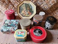 Group shot showing all nine tins together