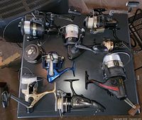 Top view of all nine spinning reels on table