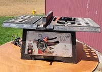 Front view showing housing, control knob, branding and power cord