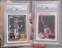 Both PSA graded Magic Johnson cards front view in holders