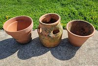 Front view of three terracotta pots