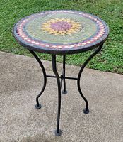 Full view of side table showing mosaic top and metal base