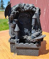 Front view of resin dragon castle fountain showing dragons, turrets and basin
