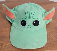 Front view showing Baby Yoda face and fabric ears