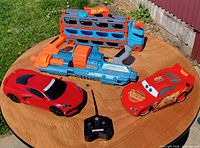 Group shot of all four toys on table outdoors
