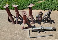 group of all jacks and stands on pavement