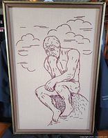 Front view of framed needlepoint artwork