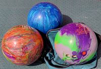 Group shot of the three bowling balls showing overall appearance and colors