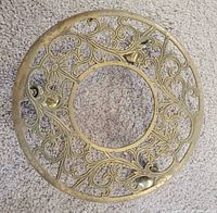 Top view showing ornate openwork brass plant stand