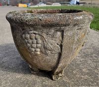 Front view showing grape relief and footed base