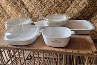 Group shot showing all six CorningWare dishes and three lids
