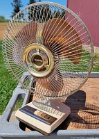 Full view of Galaxy table fan showing blades, grille, base