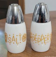 Front view showing SALT and PEPPER labels and chrome tops