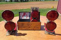 Three reflector-flares displayed with open storage case