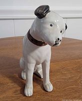 Front view of porcelain Nipper dog figurine