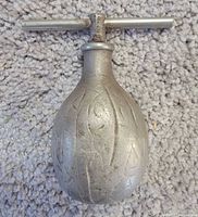 Front view of walnut-shaped nutcracker closed