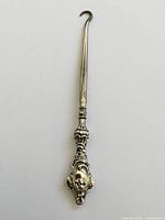 Full view of ornate sterling silver button hook