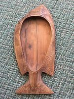 Full view of carved wooden fish bowl