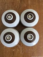 Top view of four matching Arabia Pirtti lidded jars