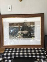 Framed lithograph in oak frame, front view