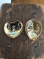 Top view showing both heart-shaped dishes with decorative painting