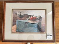 Frontal view of framed print showing artwork, matting, frame, and sizing tag