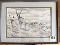 Full view of framed lithograph showing deer scene with edition sticker