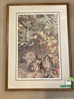 Full view of framed print showing rabbits scene, matting and wood frame