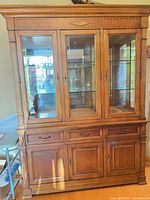 Full view of china cabinet showing upper hutch with glass doors and lower buffet