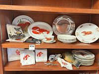 Overall view of dinnerware, napkins, utensils on shelving
