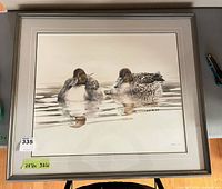 Front view of framed print showing ducks, frame and mat