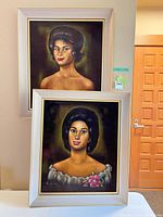 Both framed portraits side by side for scale and comparison