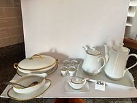 Entire lot showing coffee and tea pots, trays, egg cups, covered serving bowl, gravy boat, horseradish set