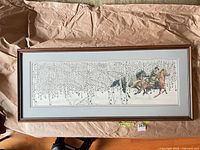 Full view of framed print on packing paper
