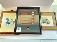 All three framed pieces laid out side by side