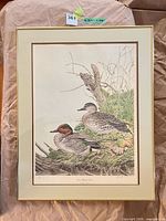 Full view of framed print showing artwork, mat, and gold frame