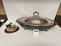 Covered serving dish and figurine full view