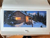 Front of unframed print showing cabin scene, edition number tab visible