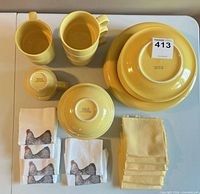 Complete dinnerware and napkins laid out