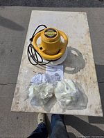 Buffer, bonnets in bags, manual on tabletop